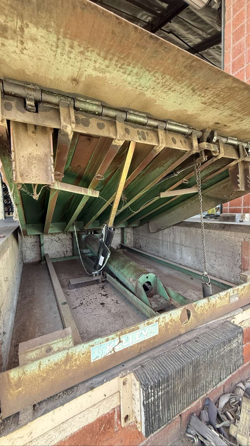Kelley mechanical dock leveler raised for lip shock replacement