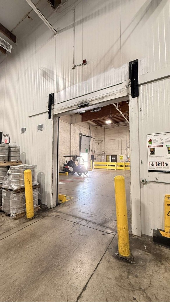 Opening prepared after removal of the old high-speed door and roll assembly.