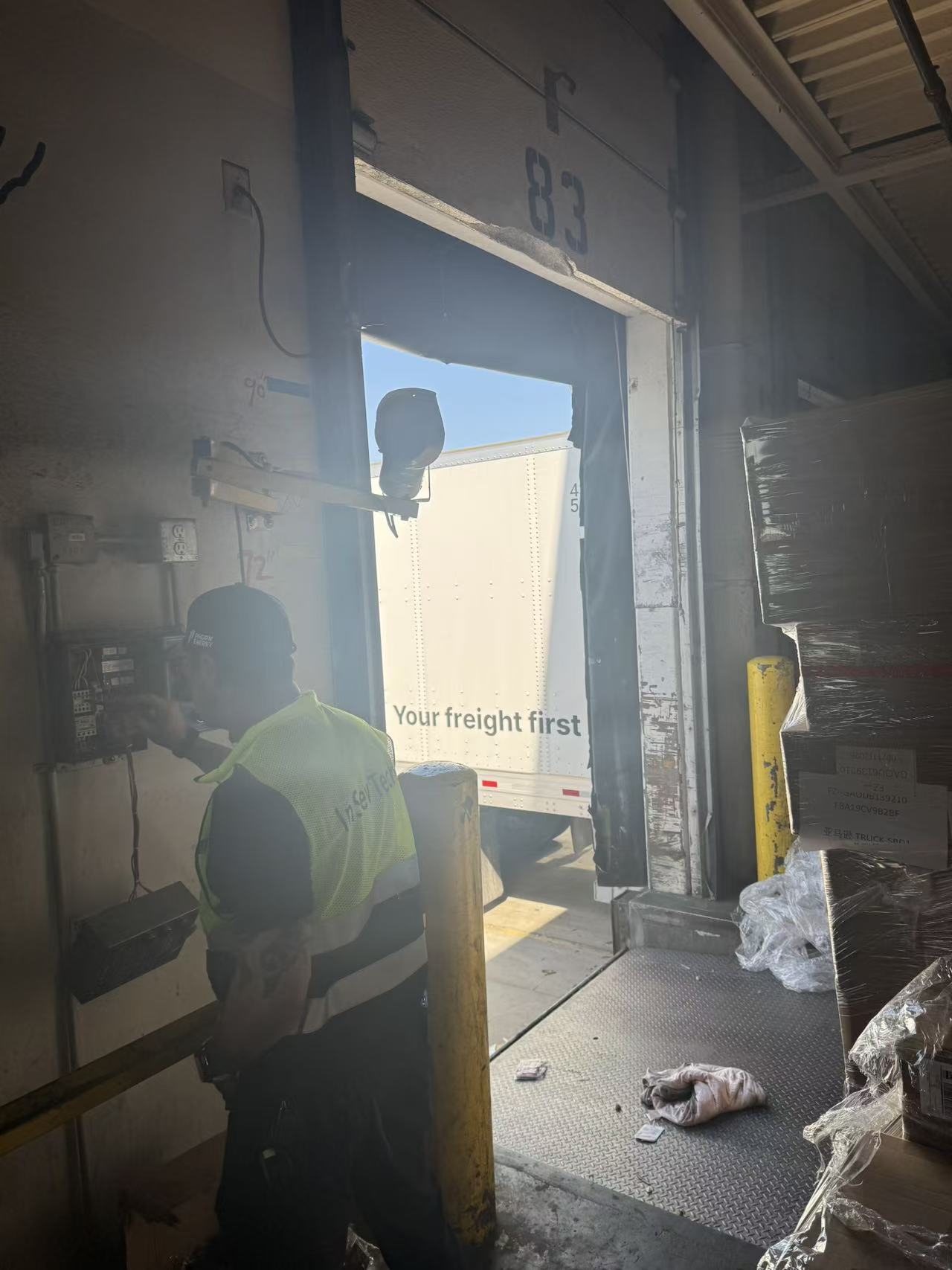 InSev Tech technician diagnosing a dock leveler control box at a Commerce, CA warehouse