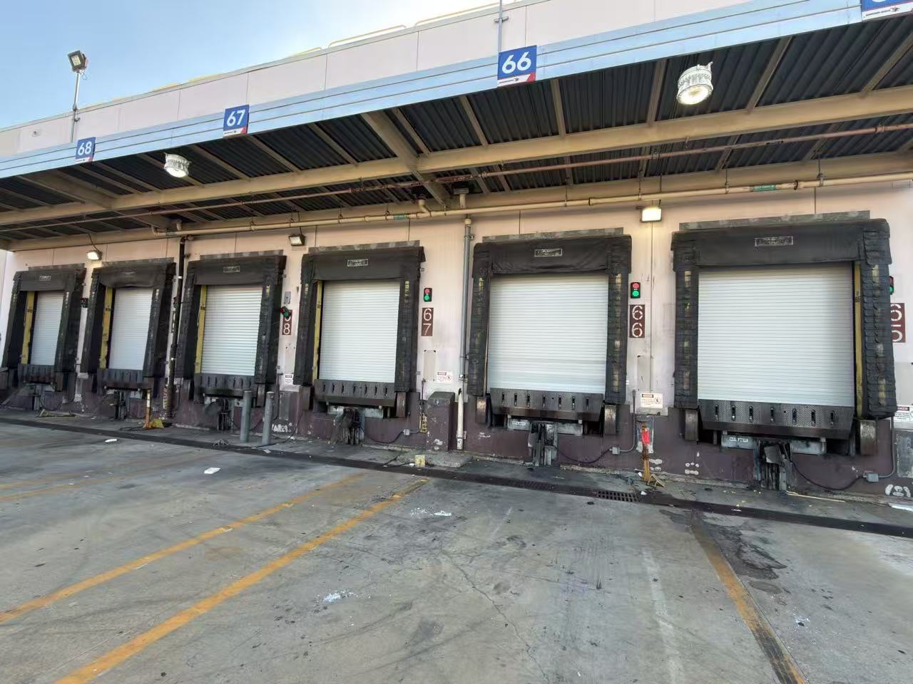 Exterior loading dock with rolling steel door openings at the Pomona food and beverage facility