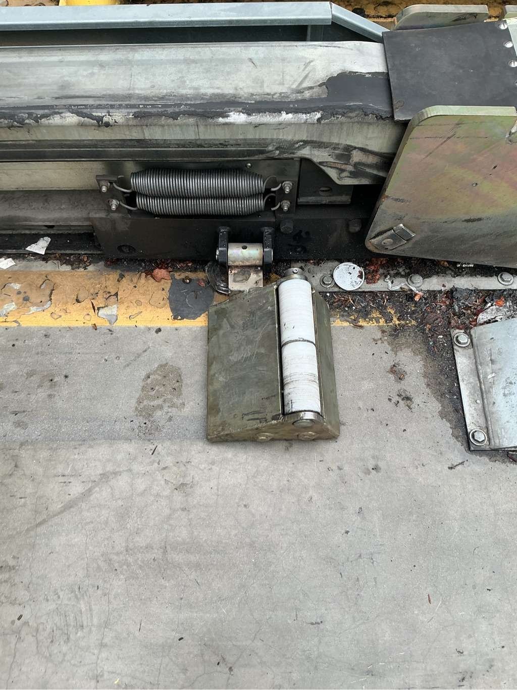Vehicle restraint trigger assembly and springs aligned during repair