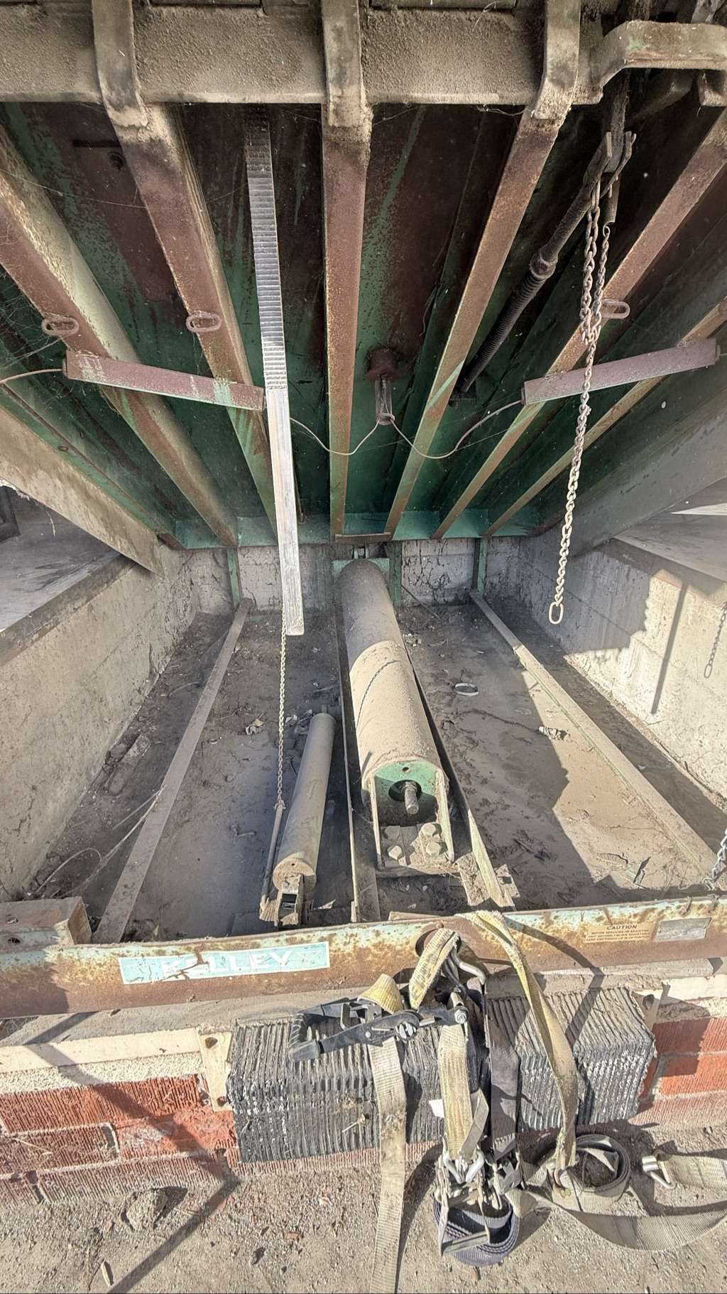 Cleaned dock leveler pit and lubricated moving components after repair
