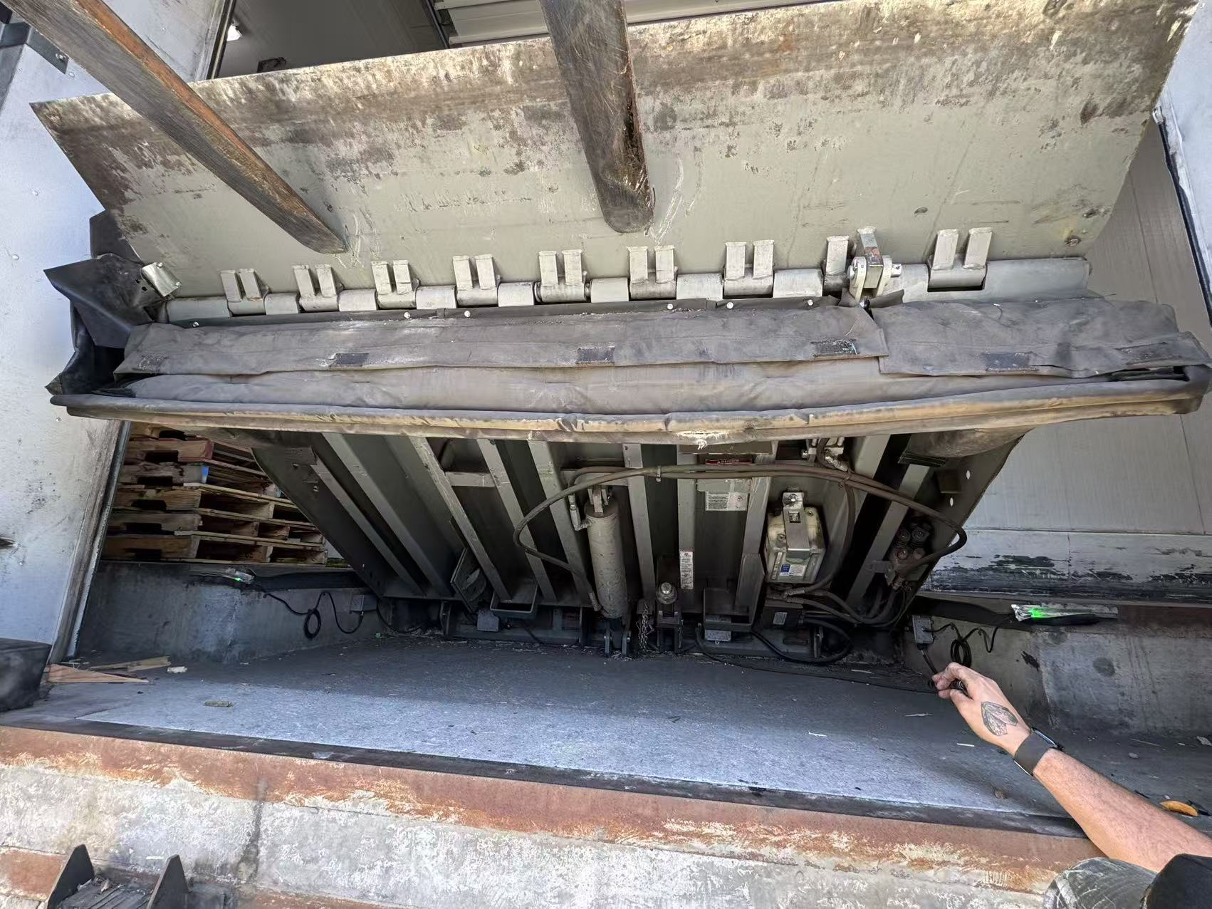 Worn loading dock leveler and dock seal at a Carson industrial facility before InSev Tech repair
