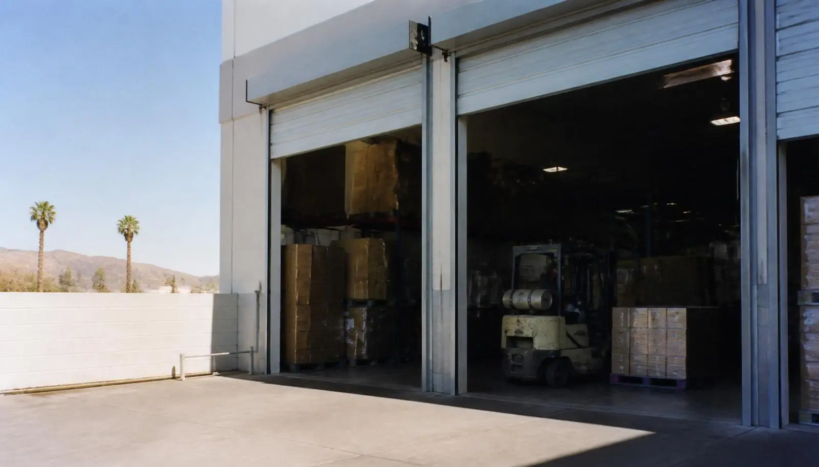 Open truck-height dock doors at a light industrial building in Anaheim CA