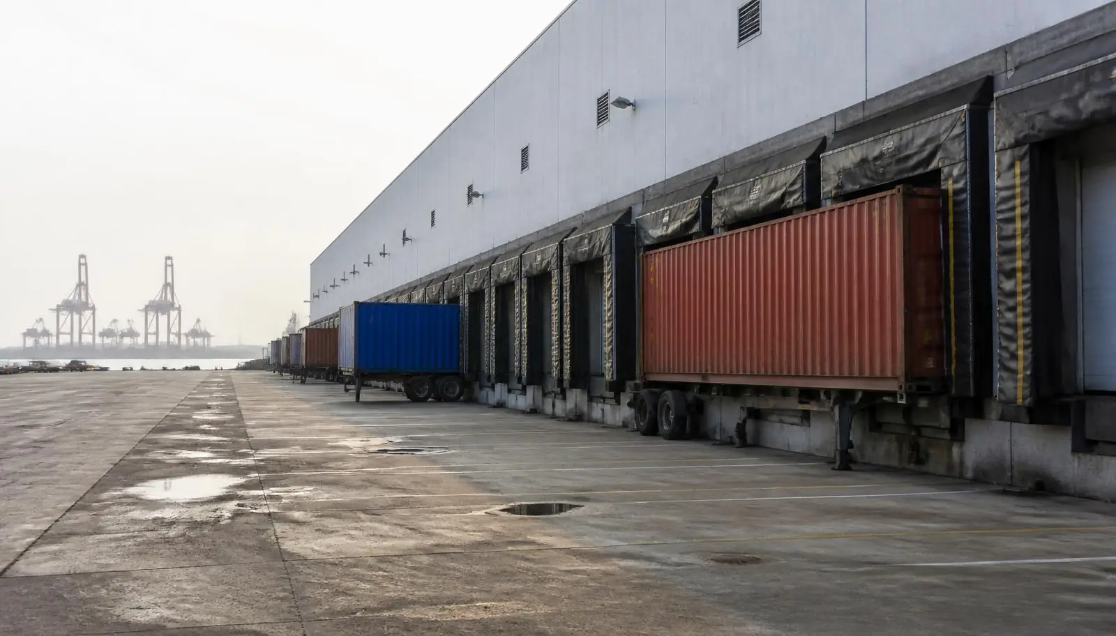 Port-adjacent dock bank with container chassis backed in at a Carson CA warehouse