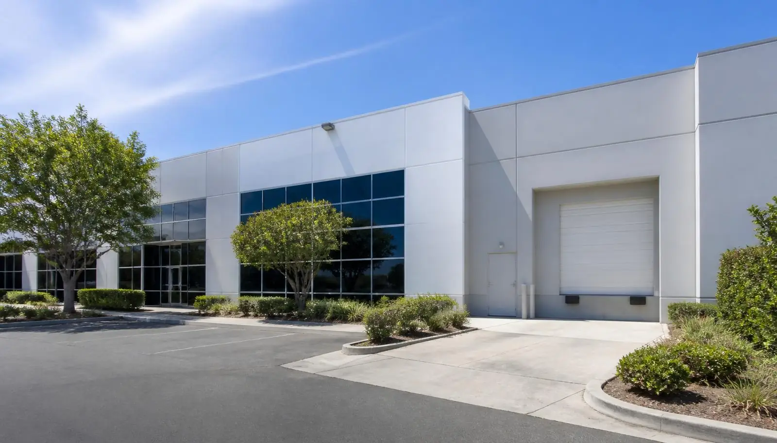 Light manufacturing building with a single dock door in an Irvine CA business park