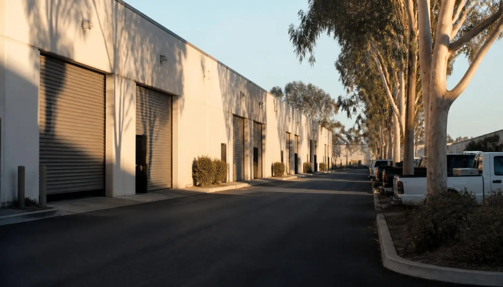 Light industrial complex with roll-up doors along a service drive in Lake Forest CA